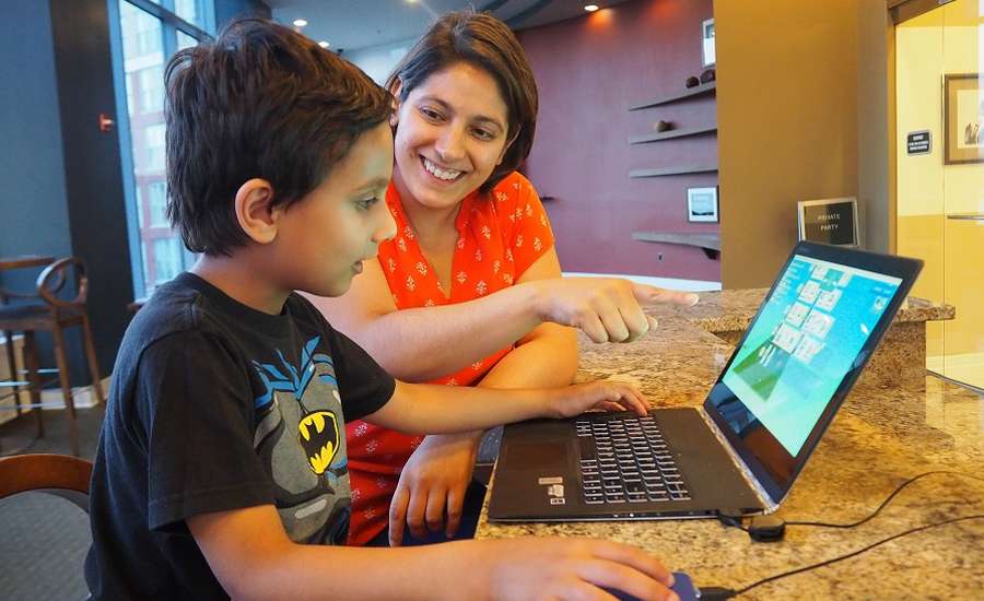Mother and son at a laptop